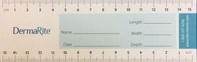 Medical measurement ruler with DermaRite branding, centimeter scale, and wound assessment fields.