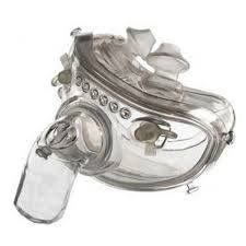 Clear full-face medical breathing mask for respiratory therapy on white background