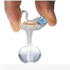 Hand holding a transparent medical device with a blue component and a round base