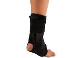 Ankle and foot brace for support, black medical orthopedic boot on a person's foot