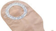 Beige medical ostomy bag with adhesive ring for stoma care and chronic condition support