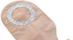 Beige medical ostomy bag with adhesive ring for stoma care and chronic condition support