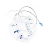 Clear medical urine drainage bag with measurement markings and tubing on a white background