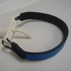 Blue adjustable medical wristband with white plastic clasp on a plain background