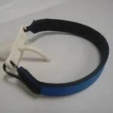 Blue adjustable medical wristband with white plastic clasp on a plain background