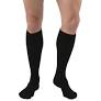 Person wearing black knee-high compression socks on bare legs