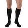 Person wearing black knee-high compression socks on bare legs