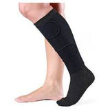 Adjustable black compression sock on lower leg for improved circulation and medical support