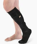 Person wearing a black compression leg sleeve for medical support and improved circulation