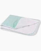 Waterproof reusable bed pad for incontinence and medical needs, folded on white background.