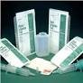 Medical supply kit with syringes, gauze, wound dressings, and containers on dark background