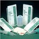 Medical supply kit with syringes, gauze, wound dressings, and containers on dark background
