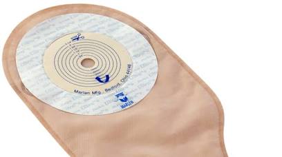 Beige ostomy pouch with adhesive barrier for stoma care and colostomy bag use