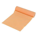 Rolled beige medical practice bandage or exercise therapy resistance band on white background