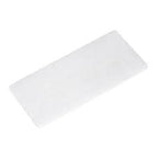 Rectangular white medical adhesive bandage pad on plain background
