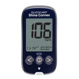 Digital blood glucose meter displaying 106 mg/dL with control buttons and clear screen.