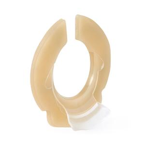 Beige medical barrier ring for ostomy care on white background