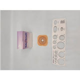 Ostomy barrier ring with measuring guide and product box on a light background