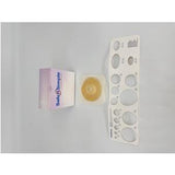 Ostomy barrier ring with sample box and stoma measuring guide on white background