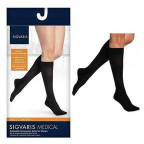 Black medical compression socks for women, knee-high, shown on legs and in retail packaging