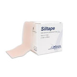 Silicone medical tape roll next to its box, soft perforated wound care tape