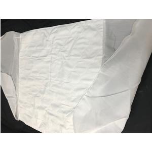 Disposable white medical bed sheet on black surface, home healthcare supply