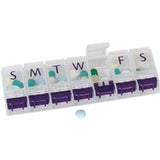Weekly pill organizer with labeled compartments and assorted daily medication