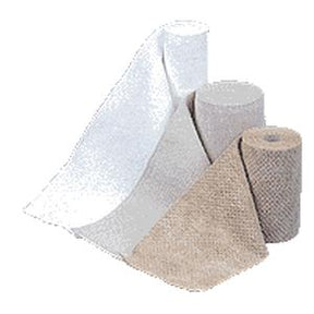 Assorted medical gauze and bandage rolls for wound care on a white background.