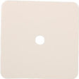 Square beige adhesive medical patch with central hole on white background