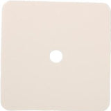 Square beige adhesive medical patch with central hole on white background