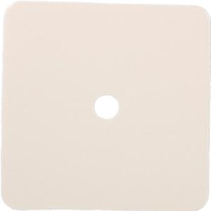 Square beige adhesive medical patch with central hole on white background