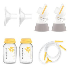 Breast pump kit with two bottles, two shields, valves, and tubing for medical use