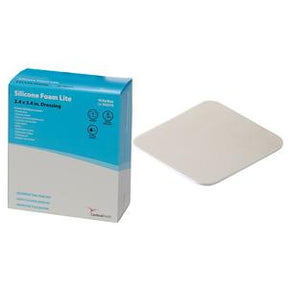 Silicone foam lite dressing for wounds, medical supply box and pad on white background