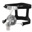 Clear CPAP nasal mask with adjustable black headgear for sleep apnea therapy