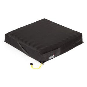 Black wheelchair seat cushion for pressure relief with ROHO label and inflation valve