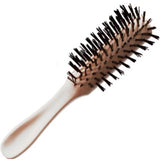 Beige handled round hair brush with black bristles for hair care and styling