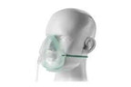 Oxygen mask with tubing on mannequin head, medical respiratory aid device