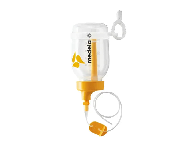 Medela supplemental nursing system with clear container, yellow lid, and feeding tube