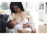 Mother using supplemental nursing system to breastfeed infant at home, medical supply aid