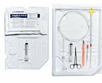 Sterile medical catheter insertion kit with syringe, forceps, and tubing on white tray