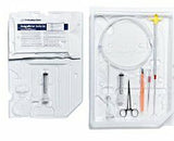Sterile medical catheter insertion kit with syringe, forceps, and tubing on white tray