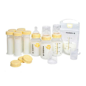 Medela breast milk storage set with bottles, lids, and milk storage bags on white background
