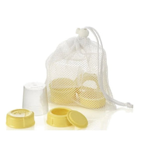 Breast pump spare parts set with yellow caps in white mesh bag, medical supply product