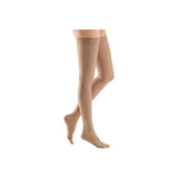 Beige thigh-high compression stockings on legs for medical support