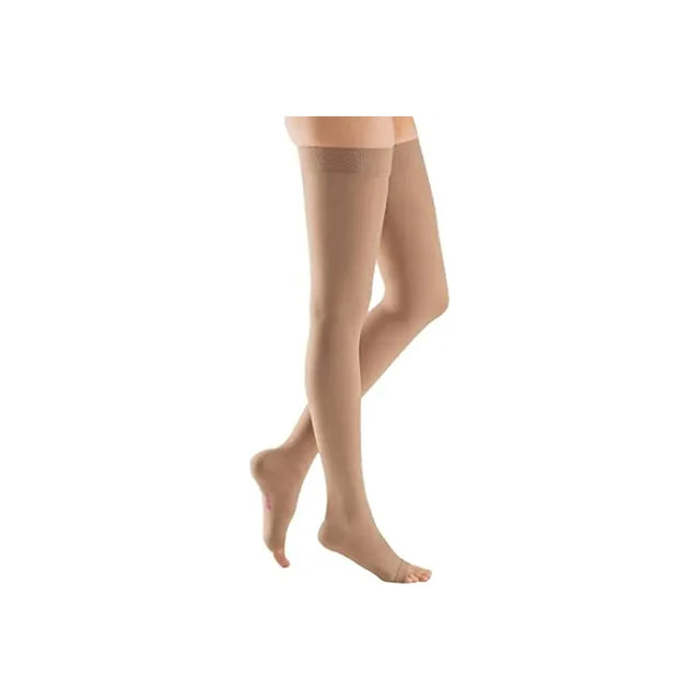 Beige thigh-high compression stockings on legs for medical support