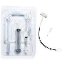 Medical feeding tube kit with syringes and connectors on white background