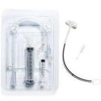 Medical feeding tube kit with syringes and connectors on white background