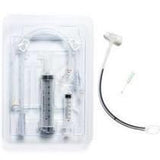 Medical feeding tube kit with syringes and connectors on white background