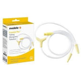 Medela Freestyle Flex breast pump tubing with yellow connectors next to product box