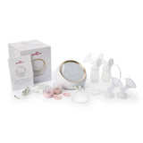 Electric breast pump kit with bottles, flanges, tubing, and accessories on white background.